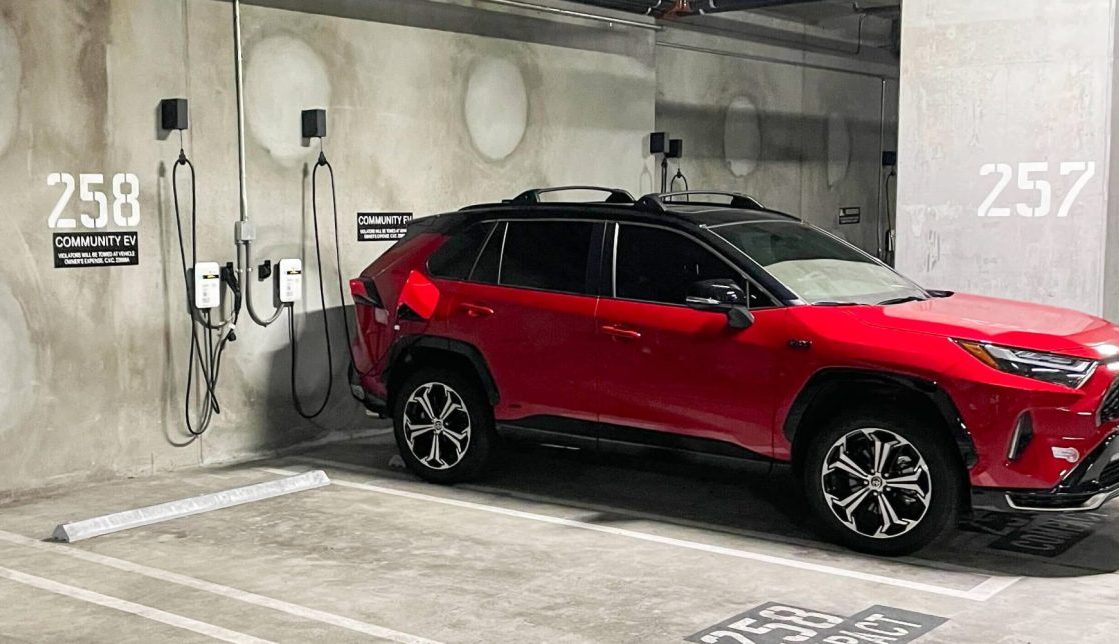 An image of an EV plugged into one of the chargers at Onni East Village